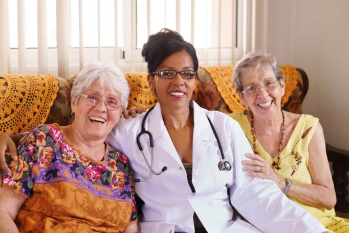 Nursing home doctor sitting on the couch with her patients in Shreveport