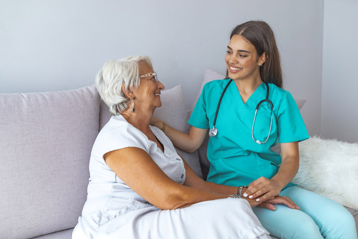 A nurse bonding with a senior woman in respite care at The Guest House in Shreveport, LA