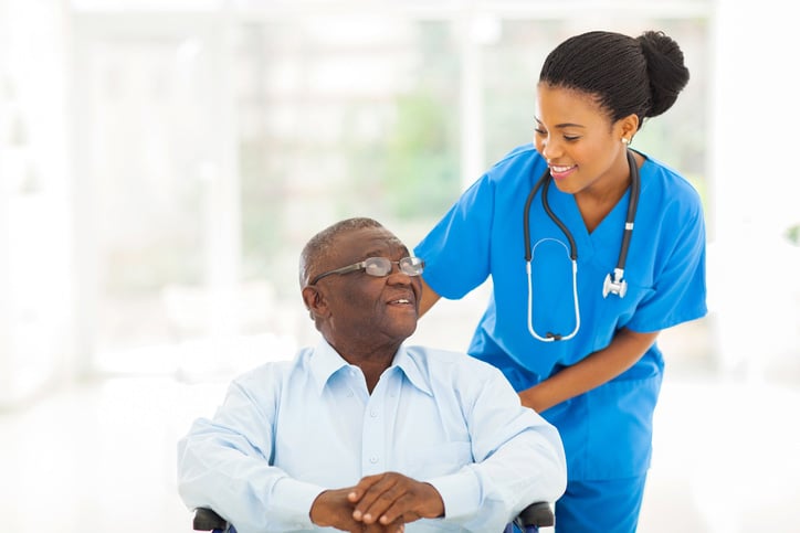 Nurse talking with patient in long term care facility